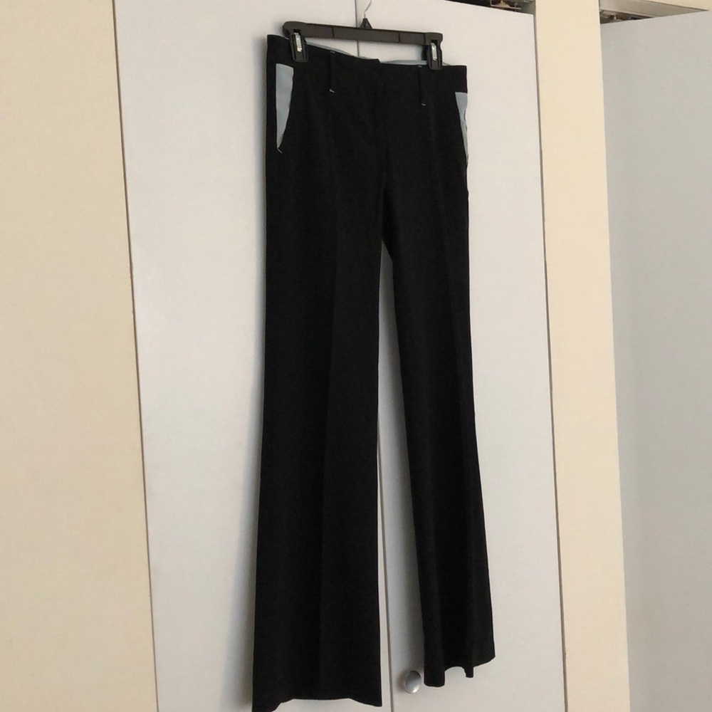 Black trousers with light blue trim detail
